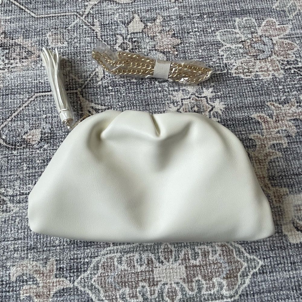 NWT Understated Leather crescent clutch with gold tone chain strap
